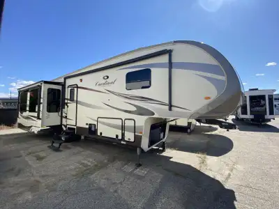 Entertain a few friends inside the Cardinal 3850RL fifth wheel by Forest River. This model has tripl...