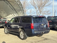 This Chevrolet Suburban boasts a Gas V8 5.3L/325 engine powering this Automatic transmission. Wipers... (image 2)