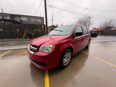 This 2015 Dodge Grand Caravan in eye-catching Red is a spacious, reliable, and family-friendly miniv...