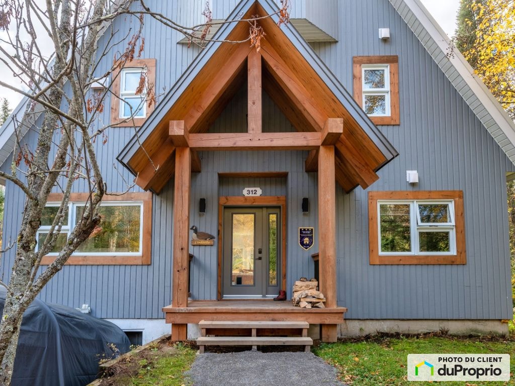 $893,150 - Cottage for sale in Lac-Superieur — photo 1
