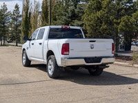 This pre-owned 2023 Ram 1500 Classic SLT Crew Cab is finished in Bright White with a clean Black and... (image 3)