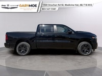 The 2026 Ram 1500 Sport is a striking truck in a bold black finish with a powerful 4x4 drivetrain, p... (image 1)