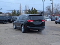 The 2026 Chrysler Grand Caravan SXT in Diamond Black Crystal Pearl with a Black interior combines fa... (image 3)