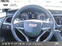The 2025 Cadillac XT6 AWD Sport, dressed in a sophisticated Stellar Black Metallic exterior and a lu... (image 9)