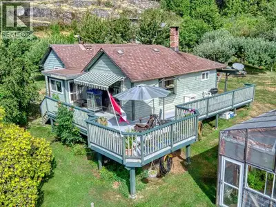 12.81 Acre HOBBY FARM with multiple shops, barns and year-round creek! Longtime owner is ready to le...