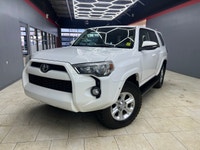 The 2015 Toyota 4Runner 4WD 4dr V6 SR5, in its striking White exterior paired with a robust 44 drive... (image 2)