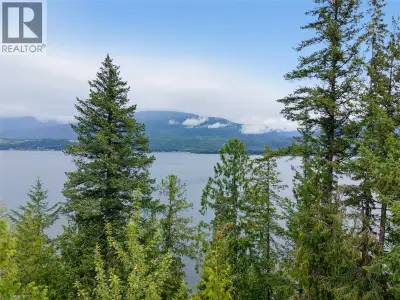 RARE OPPORTUNITY to own a spectacular 0.42-acre waterfront lot in the highly sought-after Eagle Bay...