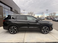 The 2023 Mitsubishi Outlander PHEV LE is a plug-in hybrid SUV that combines fuel efficiency, electri... (image 2)