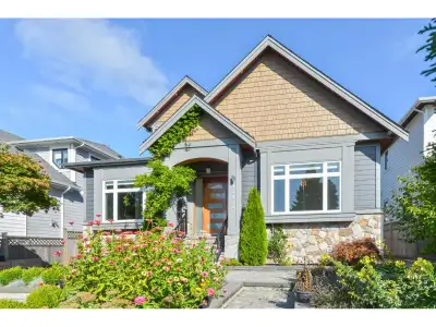 Stunning 5,400 sq. ft. luxury home featuring partial water views from the main floor, exquisite craf...
