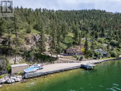Located on the shores of Okanagan Lake, this 3 bed, 2 bath gated lakeshore home with 230ft of lakefr...