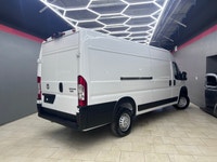 The 2025 Ram ProMaster Cargo Van in a clean white finish, equipped with front-wheel drive, is design... (image 1)