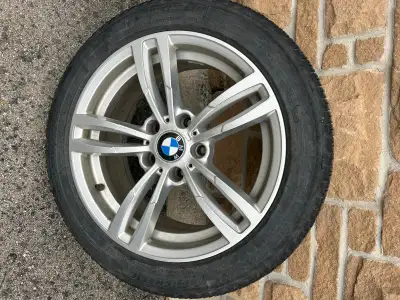Selling a set of BMW OEM 17-inch alloy rims with mounted tires.  Details: • Rim Size: 17 inch • Bolt...