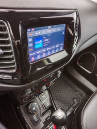 Step into the commanding presence of the 2018 Jeep Compass Altitude 4x4, cloaked in a stunning black... (image 9)