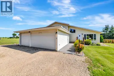 Escape to the peace and privacy of country living with this beautifully maintained 1.5-storey acreag...