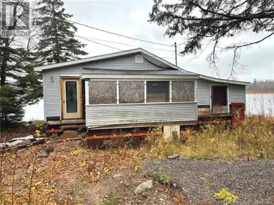 WATERFRONT PROPERTY! Welcome to 53 Country Road, a rare opportunity to create your ideal waterfront...