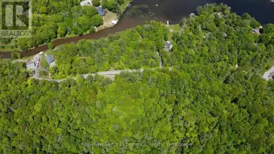Expansive 7.28 acre estate lot boasting over 600 feet of level road frontage on a municipally mainta...