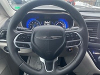 Experience the 2024 Chrysler Grand Caravan SXT in a pristine white finish, complete with efficient f... (image 8)