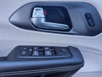 The 2024 Chrysler Pacifica Touring-L FWD, dressed in a pristine white finish, offers a smooth and co... (image 9)