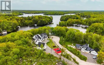 An architectural masterpiece on Gloucester Pool, this stunning waterfront retreat is a seamless blen...
