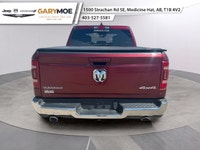 Experience the bold presence of the 2023 Ram 1500 Laramie in stunning red with the unstoppable 44 dr... (image 3)