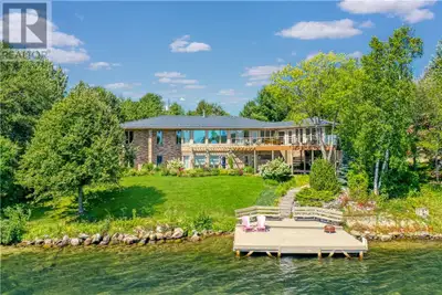 Welcome to an extraordinary opportunity on the tranquil shores of Ramsey Lake — a custom executive w...