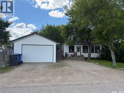 4 BEDROOMS, 2 BATHS, FIREPLACE, DOUBLE LOT, GARAGE. Discover the warmth and charm of this four-bedro...