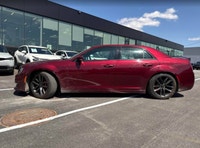 The 2023 Chrysler 300C in Velvet Red Pearl offers a commanding presence with exhilarating performanc... (image 1)