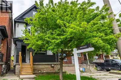 A truly breathtaking, fully renovated century home offering 5 spacious bedrooms and 2 beautifully ap...