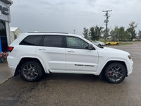 Our exclusive 2021 Jeep Grand Cherokee Limited 4X4 wraps assertive capability in a dramatic Bright W... (image 5)