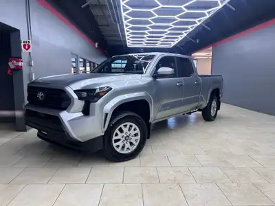 The 2025 Toyota Tacoma SR5, clad in a refined Silver finish, is ready to tackle any terrain with its...