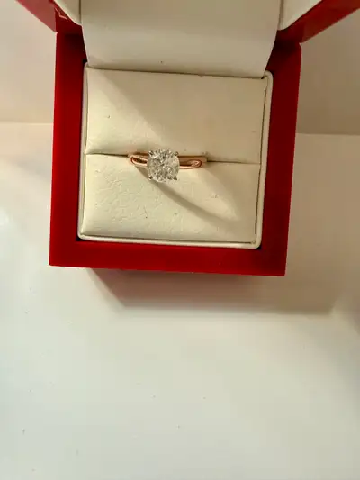 We are selling a gorgeous 1 carat diamond solitaire in 14K rose gold. ♦Size 5 3/4 Comes with origina...