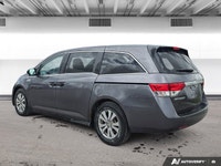 Experience the comfort and practicality of this pre-owned minivan, finished in elegant Alabaster Gre... (image 2)