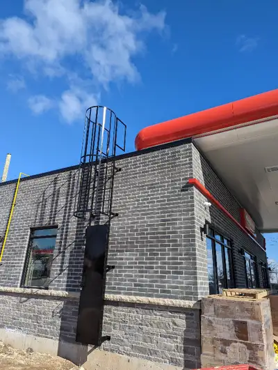 Steel fixed roof access ladders, cage walk through, Parapet wrap Ladders, bollards, parking lot sign...
