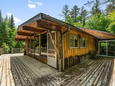 Discover waterfront serenity at this charming Pan-Abode log chalet on Ottawa River's pristine shores...
