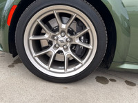 Introducing the dynamic 2023 Dodge Charger Scat Pack 392 Widebody in a striking green, complemented... (image 9)