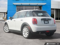 Navigate city streets with playful confidence and undeniable style in this 2021 MINI 5 Door Cooper H... (image 3)