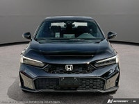 The 2026 Honda Civic Sedan Hybrid Sport Touring is a sophisticated blend of style and efficiency. It... (image 1)