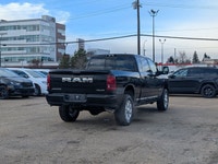 The 2026 Ram 2500 Laramie Mega Cab in Diamond Black Crystal Pearl combines heavy-duty capability wit... (image 6)