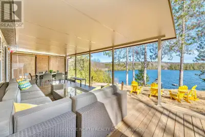 A FANTASTIC FULLY FURNISHED TURN KEY BEACHFRONT PROPERTY WITH AERIAL VIEWS OF BEAUTIFUL OLMSTEAD LAK...