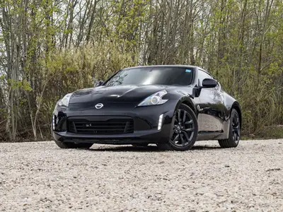 This Nissan 370Z is a sleek and sporty coupe designed for drivers who appreciate performance, style,...