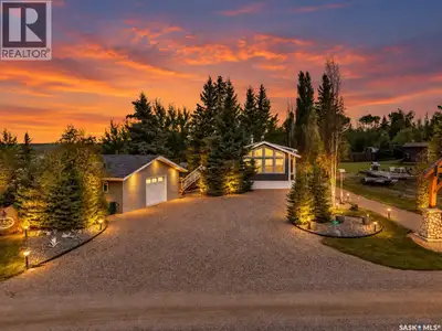 Lake life made easy! This cottage home shows 10/10 and has it all, including a BOAT SLIP. This moder...