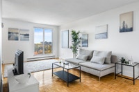 Fully renovated spacious suite features kitchen with modern features and finishes including laminate... (image 2)