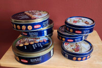 8 metal cookie tins, empty and ready to be filled with your baki