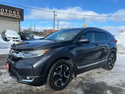 Now available at Eli Motors, this CR-V Touring all-wheel-drive SUV blends luxury, utility, and advan...