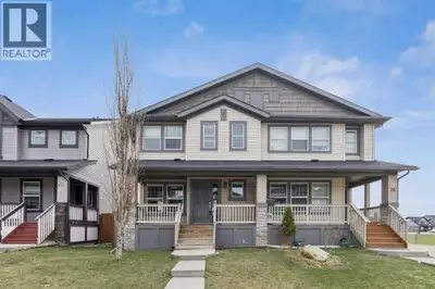 Welcome to this stylish and move-in ready half duplex in the heart of Skyview Ranch offering the per...