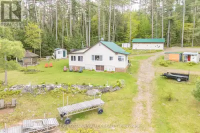 Charming Waterfront Bungalow on the Ottawa River! Set on 198 feet of pristine riverfront, this beaut...