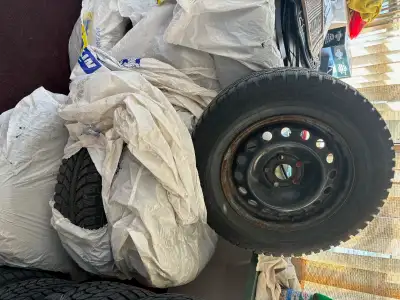 Four winter tires 205/70-15 on steel rims. More than 70% left. Came from Chevy Cruze 2013.