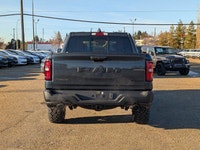 The 2026 Ram 1500 Rebel Crew Cab in Granite Crystal Metallic makes a bold statement with its rugged... (image 4)