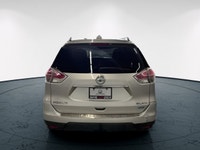 Meet the 2015 Nissan Rogue SL, a silver AWD SUV that perfectly combines robust handling with everyda... (image 5)