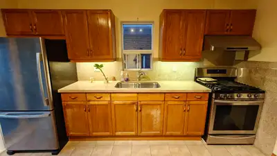 Used kitchen with solid red oak doors and a granite countertop, View more